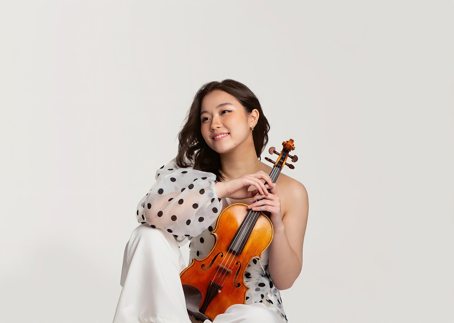 Coco Tomita with her violin. Image courtesy Brett & Lindsey Clarke (Made of Pixels)